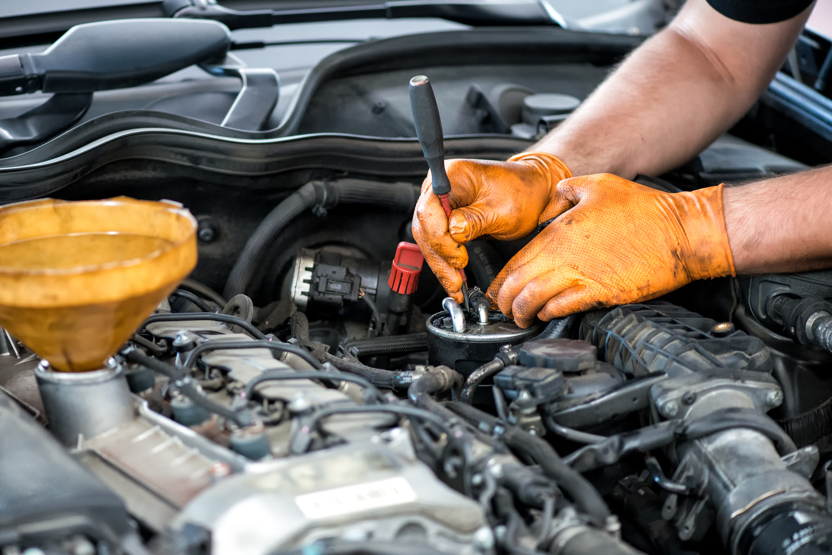 Mechanic working on a diesel filter